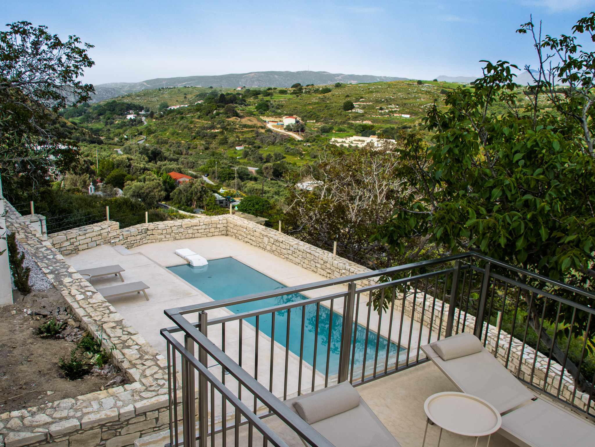 Private pool near the terrace with valley and hills beyond