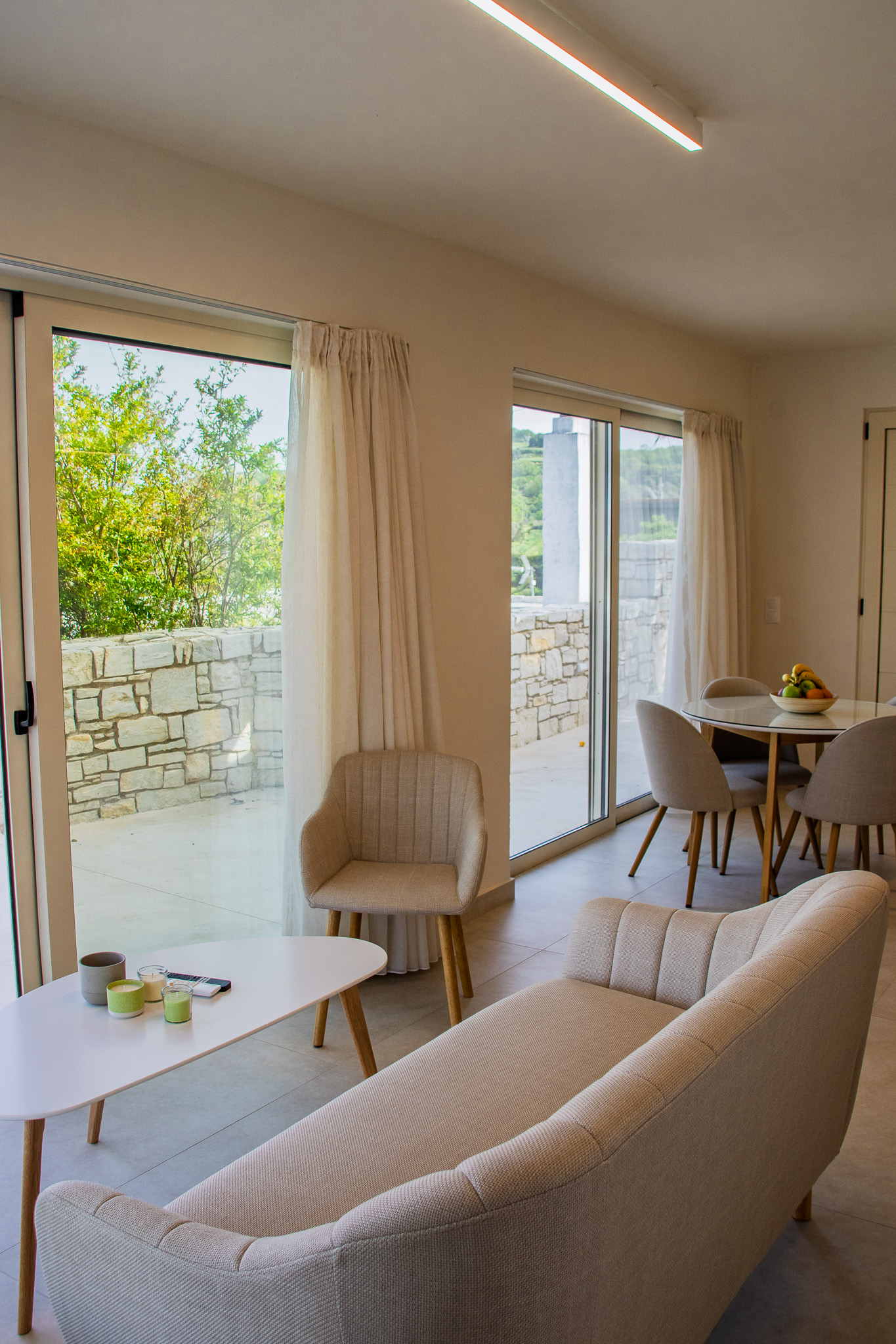Living and dining space with large terrace doors